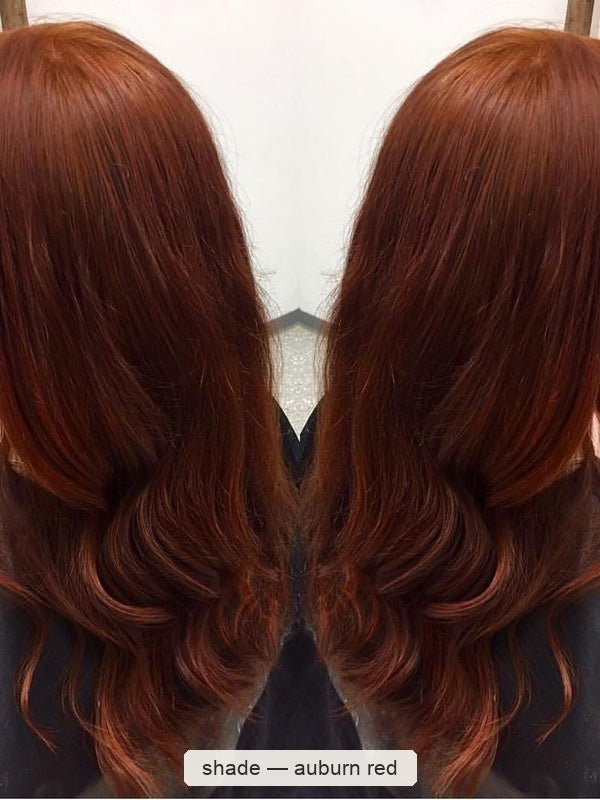 Two rear views of glossy dark auburn hair with loose curls at the ends, shown side by side with the shade name Auburn Red beneath.