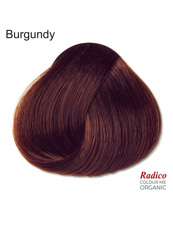 Rounded teardrop-shaped tuft of smooth, dark plum-red hair beneath the shade name Burgundy, with the Radico Colour Me Organic logo at the lower right.