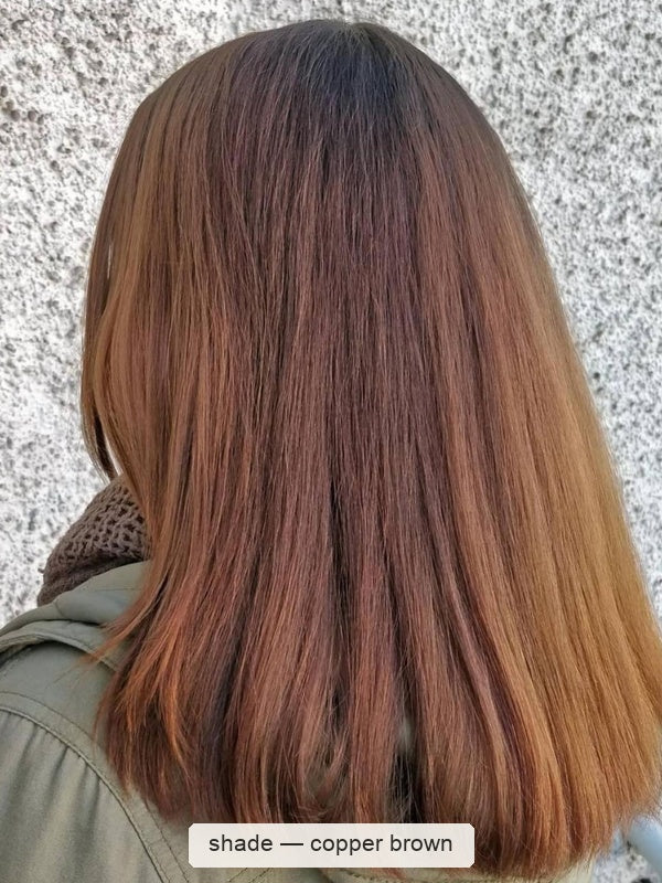 Rear view of smooth, shoulder-length brown hair with warm copper ends and darker roots, with a small label beneath identifying the shade as Copper Brown.