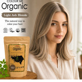 Radico Light Ash Blonde graphic showing a woman with smooth beige-brown hair and pale ash-blonde strands beside a brown paper hair-colour pouch, with the shade name on a grey-brown brushstroke above.