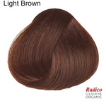 Rounded teardrop-shaped tuft of smooth, reddish-brown hair beneath the shade name Light Brown, with the Radico Colour Me Organic logo at the lower right.