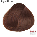 Rounded teardrop-shaped tuft of smooth, reddish-brown hair beneath the shade name Light Brown, with the Radico Colour Me Organic logo at the lower right.