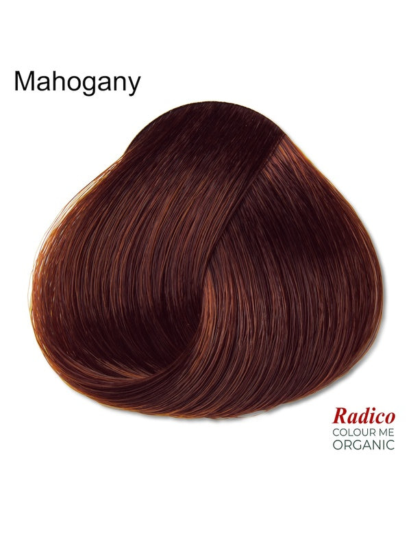 Rounded teardrop-shaped tuft of smooth, deep wine-brown hair beneath the shade name Mahogany, with the Radico Colour Me Organic logo at the lower right.