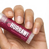 Hand holding Hurraw! Organic Lip Balm - Raspberry 4.8g