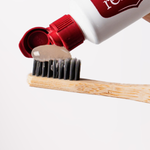 Red Seal Whitening Toothpaste being applied to a toothbrush