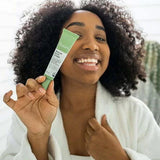 Botani Rescue Acne Cream 30g — model holding rescue acne cream