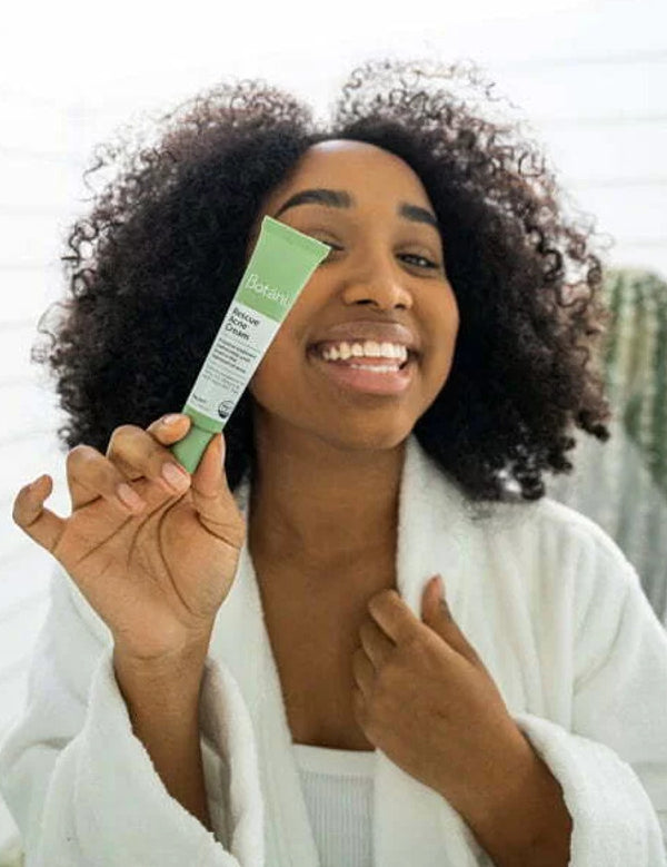 Botani Rescue Acne Cream 30g — model holding rescue acne cream