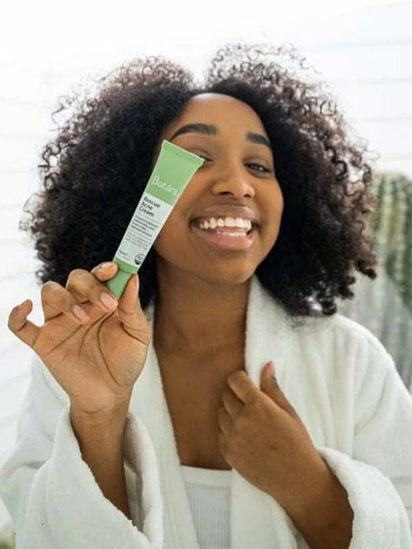 Botani Rescue Acne Cream 30g — model holding rescue acne cream