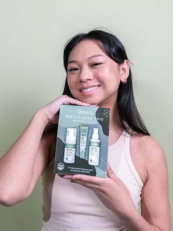 Botani Rescue Acne Trio Pack — model holding acne trio pack