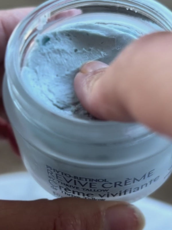 Hand taking blue Phyto-Retinol Revive Creme from the jar – Thrive Tallow Phyto-Retinol Revive Creme 50ml