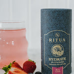 Ritua HYDRATE Berry with a prepared berry drink