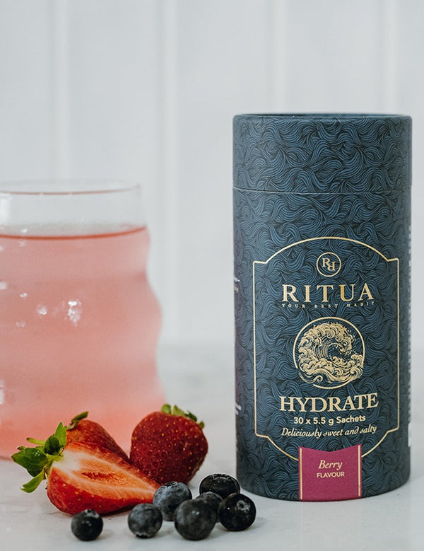 Ritua HYDRATE Berry with a prepared berry drink