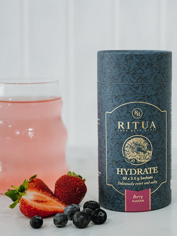 Ritua HYDRATE Berry with a prepared berry drink