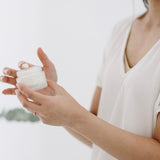 Woman holding Salt + Glow Skin Soufflé moisturiser