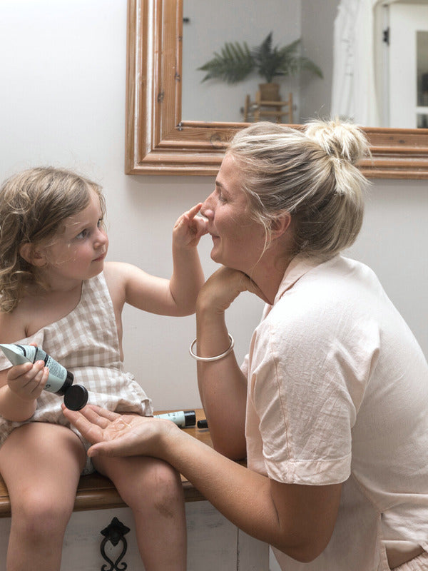 Woman and child enjoying a skincare moment with Sanctum Hydrating Gel Mask at home.