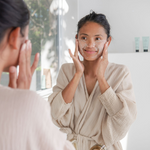 Woman applying Sanctum Gentle Face Exfoliant