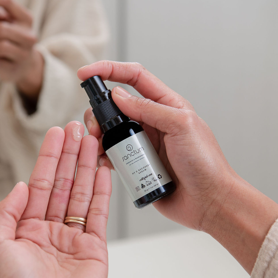 Sanctum HY C Recovery Serum dispensed onto a hand