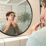 Man applying Sanctum Men's Face Moisturiser
