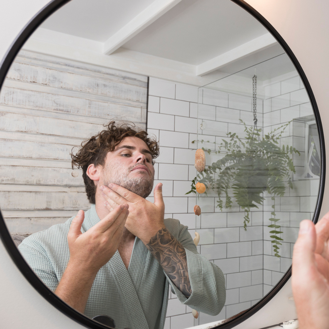 Man washing his face with Sanctum Men's Facial Wash