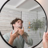 Man washing his face with Sanctum Men's Facial Wash