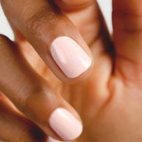 Close-up of natural nails wearing Sienna Byron Bay Serenity nail polish in a pale pink shade.