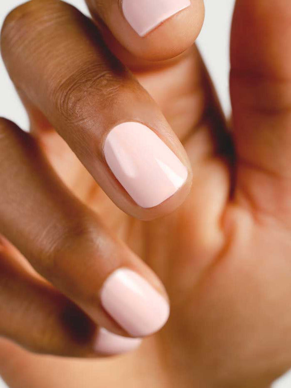 Close-up of natural nails wearing Sienna Byron Bay Serenity nail polish in a pale pink shade.
