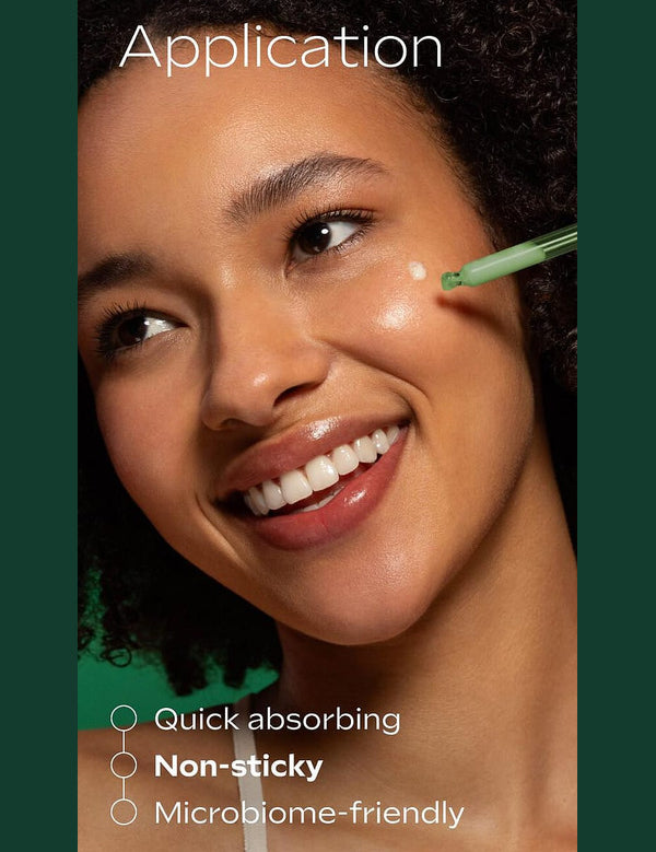Applying Weleda Skin Food Super Serum to the cheek
