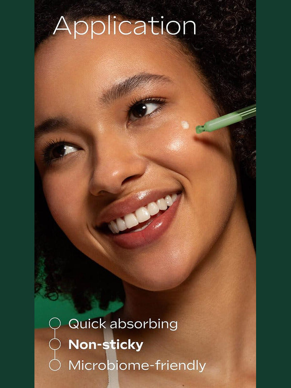Applying Weleda Skin Food Super Serum to the cheek