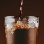 Sodii Everyday Hydration Salts Salty Chocolate being poured into an iced glass