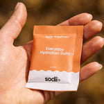 Sodii Everyday Hydration Salts Salty Grapefruit single serve held outdoors