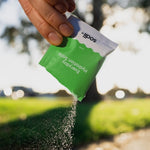 Sodii Everyday Hydration Salts Salty Kiwi being poured into a bottle outdoors