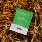 Sodii Everyday Hydration Salts Salty Kiwi styled on natural straw