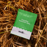Sodii Everyday Hydration Salts Salty Kiwi styled on natural straw