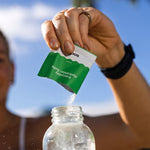 Sodii Everyday Hydration Salts Salty Kiwi being mixed after an outdoor workout
