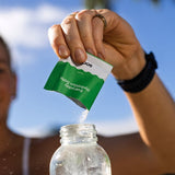 Sodii Everyday Hydration Salts Salty Kiwi being mixed after an outdoor workout