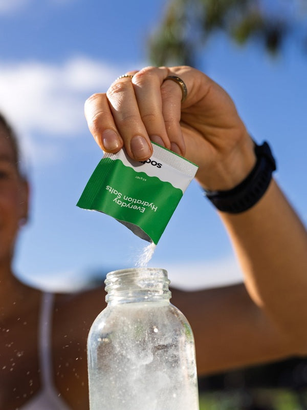 Sodii Everyday Hydration Salts Salty Kiwi being mixed after an outdoor workout