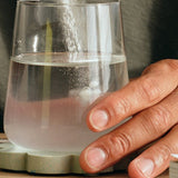 Sodii Salty Kiwi hydration salts being mixed into water