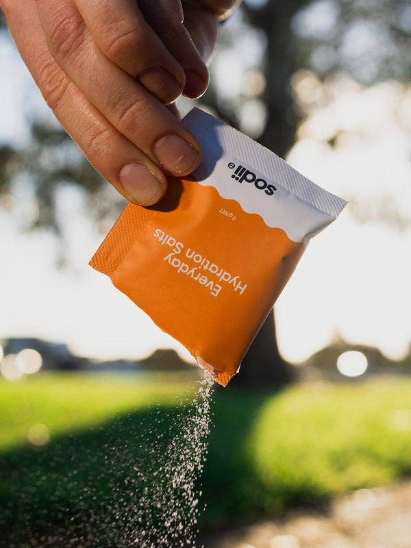 Sodii Everyday Hydration Salts Salty Mandarin being poured outdoors
