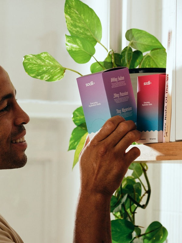Sodii Everyday Hydration Salts Salty Passionfruit hydration flavours being selected from a shelf
