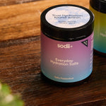 Sodii Everyday Hydration Salts Salty Passionfruit tubs styled on a timber table