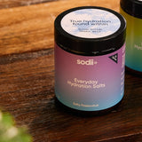 Sodii Everyday Hydration Salts Salty Passionfruit tubs styled on a timber table