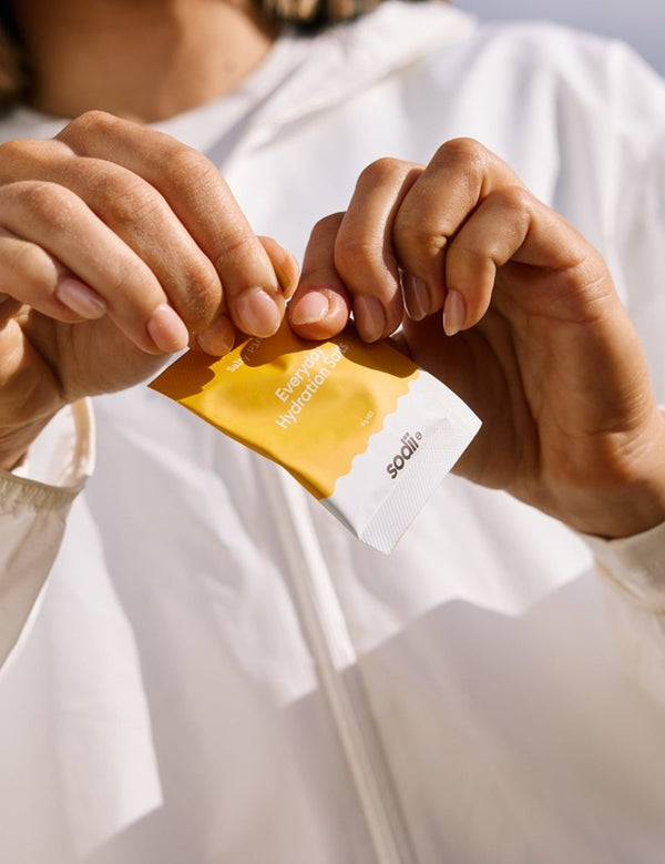 Sodii Everyday Hydration Salts Salty Pineapple sachet being opened