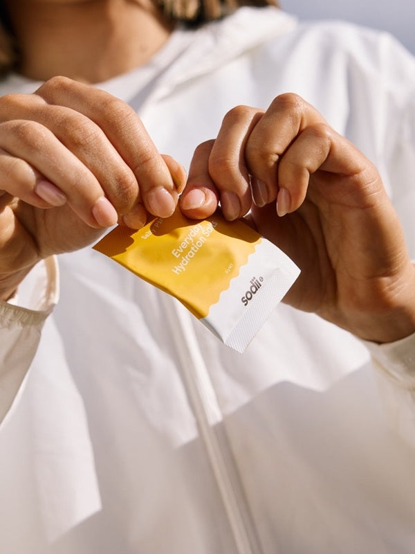 Sodii Everyday Hydration Salts Salty Pineapple sachet being opened