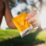 Sodii Everyday Hydration Salts Salty Pineapple held outdoors after exercise