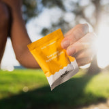 Sodii Everyday Hydration Salts Salty Pineapple held outdoors after exercise