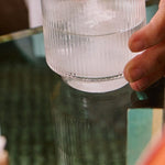 Sodii Salty Pineapple hydration salts being mixed into water