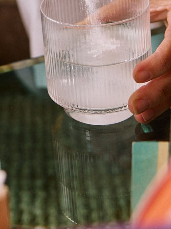 Sodii Salty Pineapple hydration salts being mixed into water