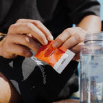 Sodii Everyday Hydration Salts Salty Raspberry being mixed into a water bottle