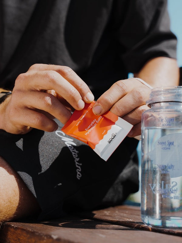 Sodii Everyday Hydration Salts Salty Raspberry being mixed into a water bottle