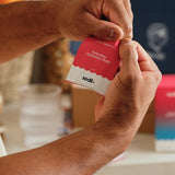 Sodii Everyday Hydration Salts Salty Raspberry sachet being opened at home